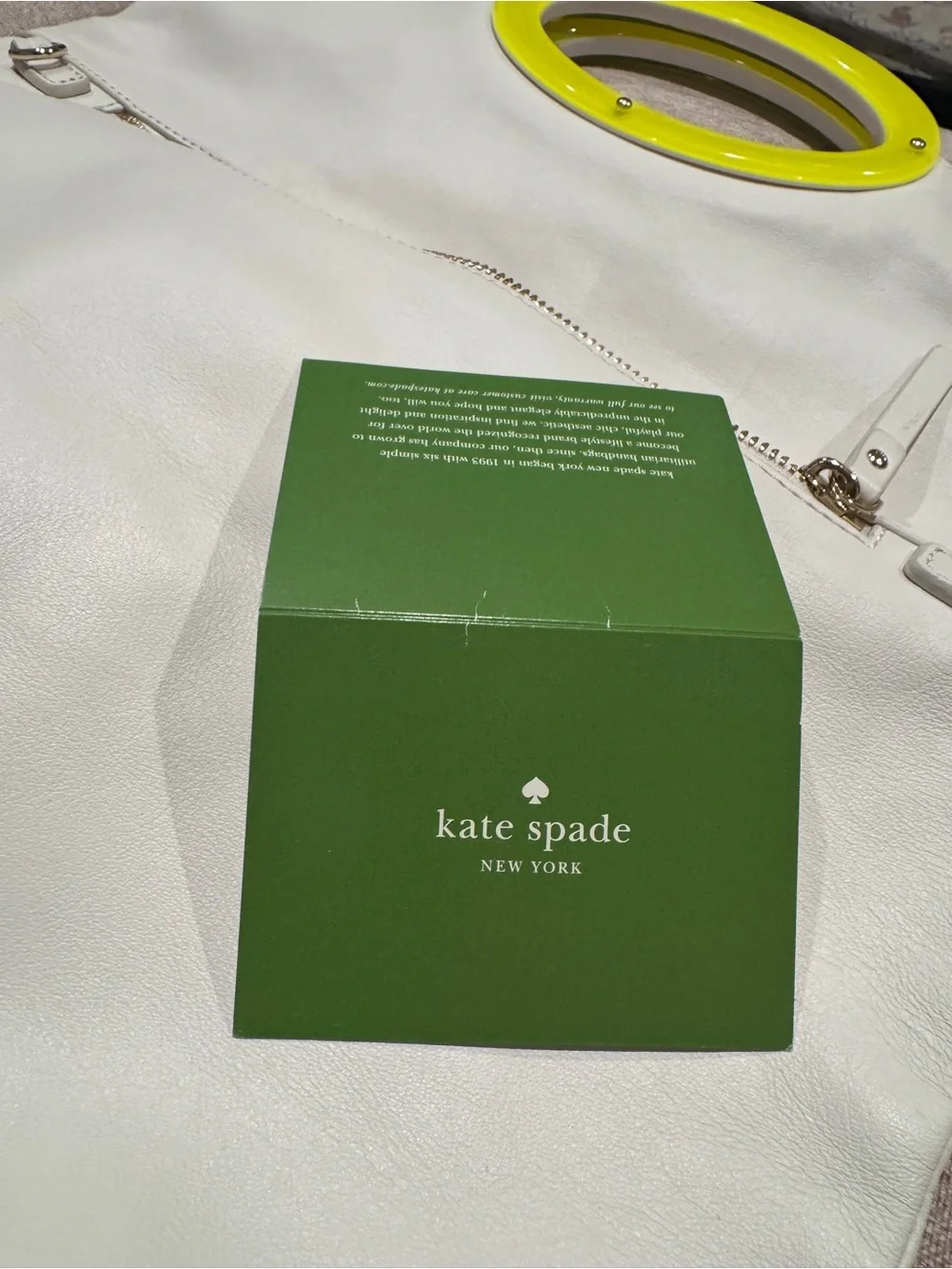 kate spade Cream Leather Tote with Yellow Circular Handle Accent